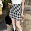 Black Plaid Pleated School Girl Skirt | Ningning - Aespa -Amped Apparel Black Plaid Pleated School Girl Skirt Ningning Aespa 1 600x727 1