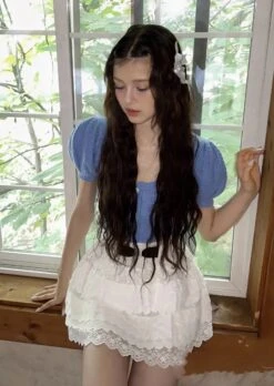 White Layered Lace Skirt With Bow | Danielle - NewJeans 13 White Layered Lace Skirt With Bow | Danielle - NewJeans -Amped Apparel Danielle NewJeans White Layered Lace Skirt With Bow 1