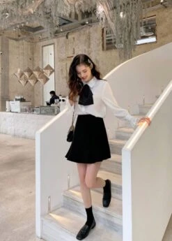 White Bell Sleeve Blouse With Black Bow Tie 30 White Bell Sleeve Blouse With Black Bow Tie -Amped Apparel IU Oversized Bow Tie And Laced Bell Cuffs Shirt 00006 600x837 1