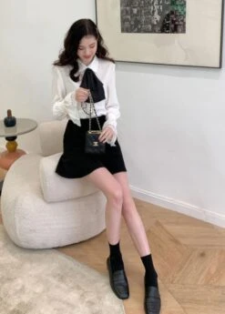 White Bell Sleeve Blouse With Black Bow Tie 27 White Bell Sleeve Blouse With Black Bow Tie -Amped Apparel IU Oversized Bow Tie And Laced Bell Cuffs Shirt 00011 600x837 1