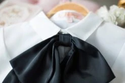 White Bell Sleeve Blouse With Black Bow Tie 41 White Bell Sleeve Blouse With Black Bow Tie -Amped Apparel IU Oversized Bow Tie And Laced Bell Cuffs Shirt 00022 600x399 1