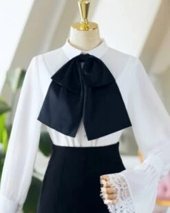 White Bell Sleeve Blouse With Black Bow Tie 34 White Bell Sleeve Blouse With Black Bow Tie -Amped Apparel IU Oversized Bow Tie And Laced Bell Cuffs Shirt 2