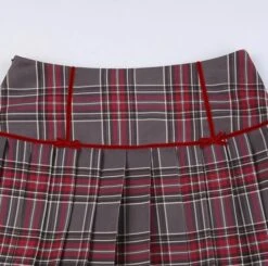 Red Plaid Mini Bow Pleated Skirt | Haerin - NewJeans -Amped Apparel Red Plaid Mini Bow Pleated Skirt Haerin NewJeans 12 600x596 1