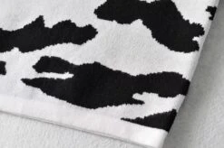 Black And White Cow Pattern Polo Shirt | Soyeon - (G)I-DLE -Amped Apparel Soyeon GI DLE Black And White Cow Pattern Polo Shirt 8 600x398 1