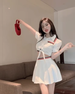 White Pleated Skirt With Red And Blue Banded Waist | Lisa - BlackPink -Amped Apparel White Pleated Skirt With Red And Blue Banded Waist Lisa BlackPink Idol 4 600x750 1